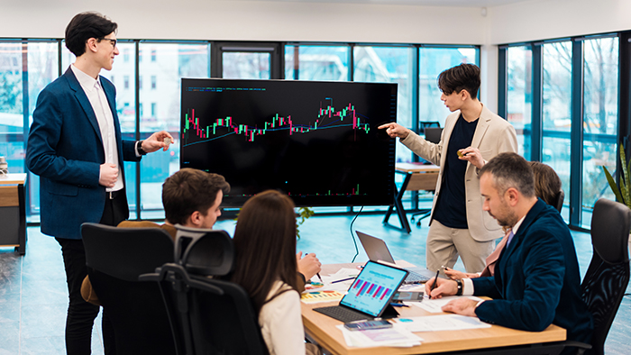 two young worker leading business meeting about cryptocurrencies in an office